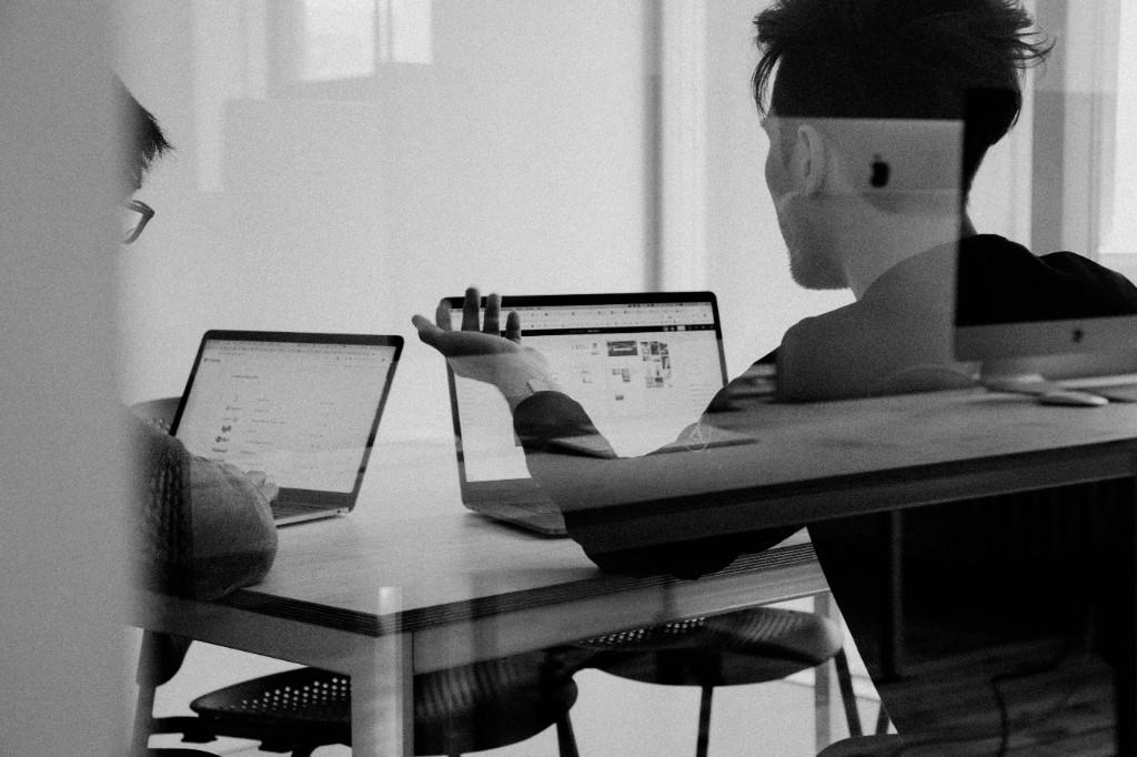 Professionals collaborating on laptops — remote business support South Africa